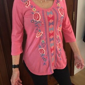 Johnny was pink/apricot tunic top.